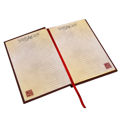 Cahier A5 Premium Skull One Piece ouvert avec pages lignées, logo Straw Hat Crew et marque-page rouge NIPPON DOKI STORE