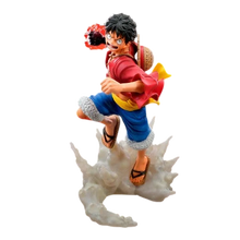 Figurine NIPPON DOKI STORE de Monkey D. Luffy en pleine action avec son poing enflammé sur un socle effet fumée